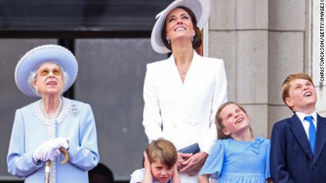 Queen Elizabeth II, Prince Louis, Catherine, Duchess of Cambridge, Princess Charlotte and Prince George watch the Royal Air Force flypast from the balcony of Buckingham Palace on Thursday.