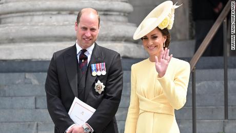 Catherine, Duchess of Cambridge wore a buttery yellow ensemble, with a tea-length dress paired with a twisted waist detail and pearl drop earrings.