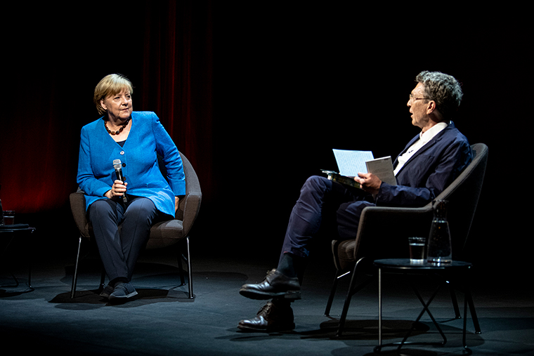 Former German Chancellor Angela Merkel answers questions from journalist and author Alexander Osang at the Berliner Ensemble in Berlin, Germany, Tuesday, June 7. 