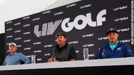 Mickelson speaks in a press conference, seated alongside Justin Harding and Chase Koepka.