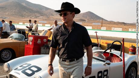 Matt Damon as Carroll Shelby in 2019 film &quot;Ford v Ferrari&quot; stands in front of a replica Shelby Cobra manufactured by Hi-Tech Automotive.