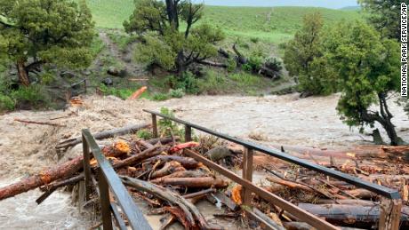 Across the US, a day of extreme weather prompts heat warnings, severe flooding and power outages for hundreds of thousands