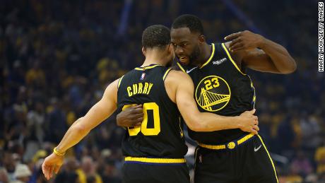 Green hugs Curry prior to Game 1 against the Dallas Mavericks in the 2022 Western Conference Finals.