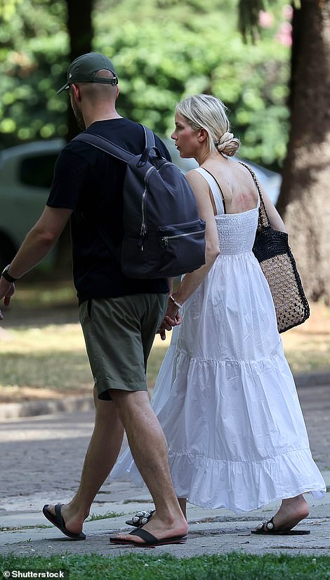 I've got you: The newlyweds sweetly held hands and they strolled along