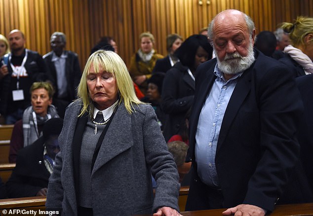 Reeva Steenkamp's parents June Steenkamp and Barry Steenkamp react after Paralympic gold medalist Oscar Pistorius was convicted of murdering their daughter in a South African court