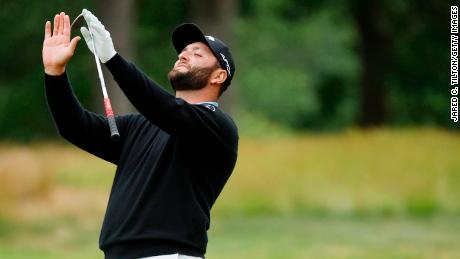 Rahm reacts after his second shot on the 12th hole.