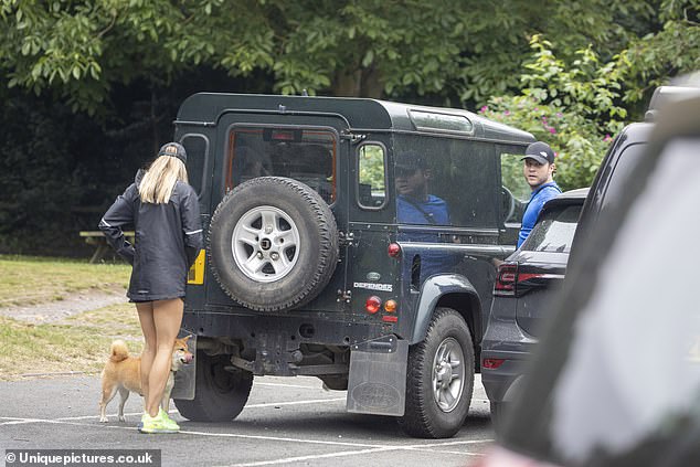 Way home: She also sported a black baseball cap on her head, and let her blonde locks billow in the breeze