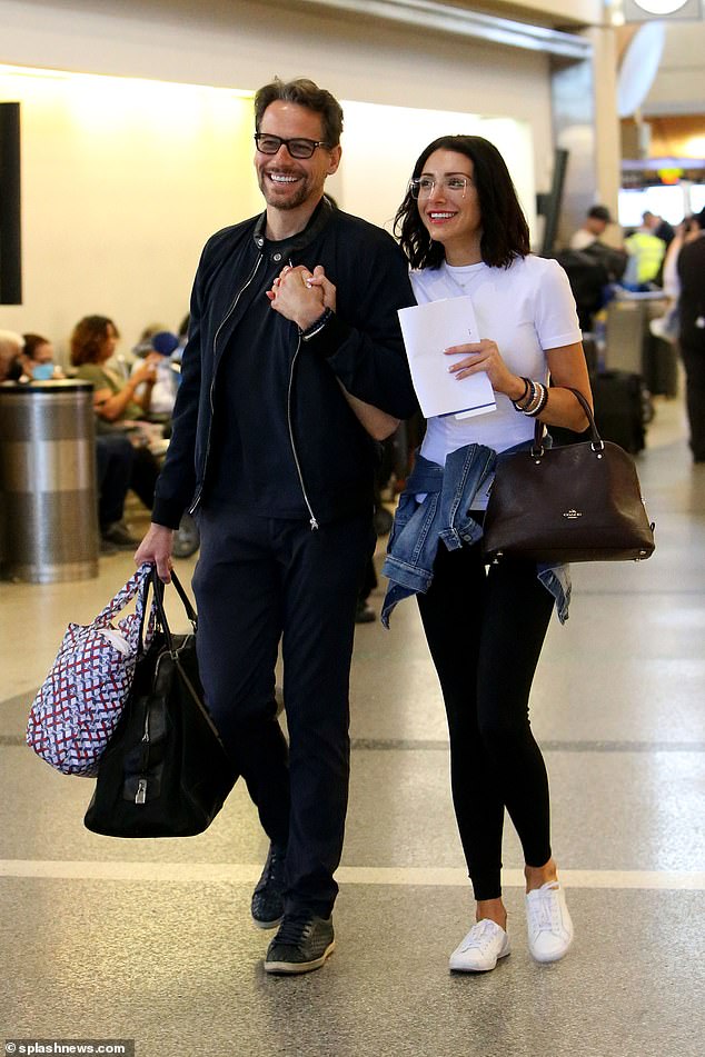 Low-key: Appearing to be delighted in each other's company, both dressed casually for their long haul flights with the Liar star donning a black bomber jacket and T-shirt