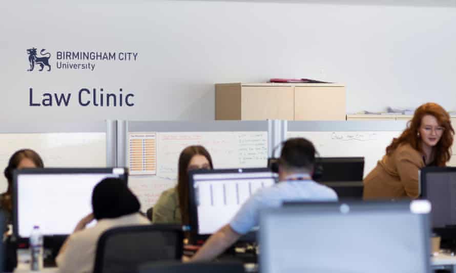 Lizzy Parkes (far right) at work in the helpline’s office