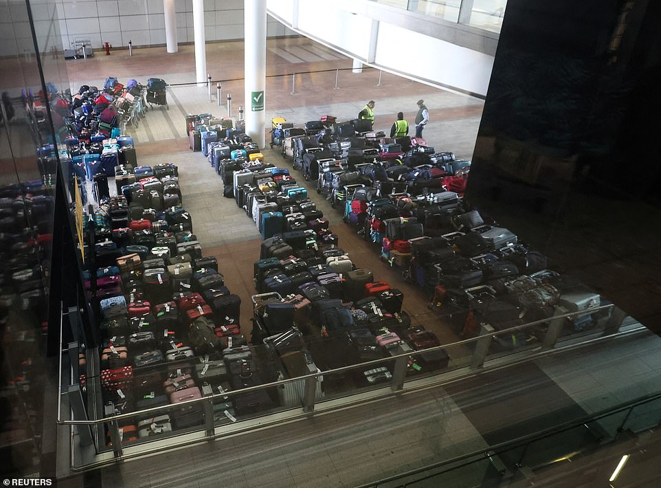 This morning (June 19) Heathrow airport staff stood around piles of left-behind luggage after a 'technical issue' meant hundreds of passengers left the airport without their belongings