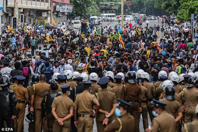 Protesters shout slogans during an anti government protest rally in Colombo, Sri Lanka on Thursday. The country is in economic crisis which may prompt more outward migration