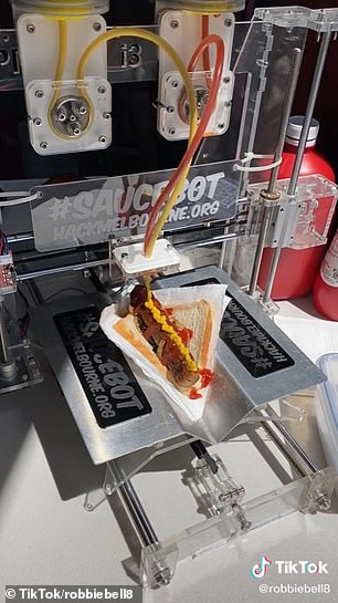 The machine is simple to use, just place the sausage sizzle with a napkin in the holder and watch it do its magic