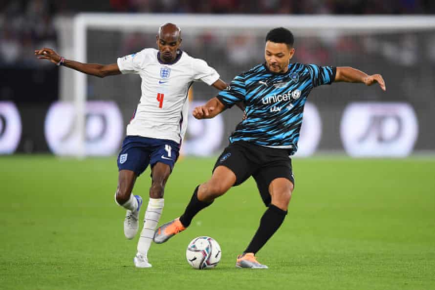 Tussling with Mo Farah at Soccer Aid this month.