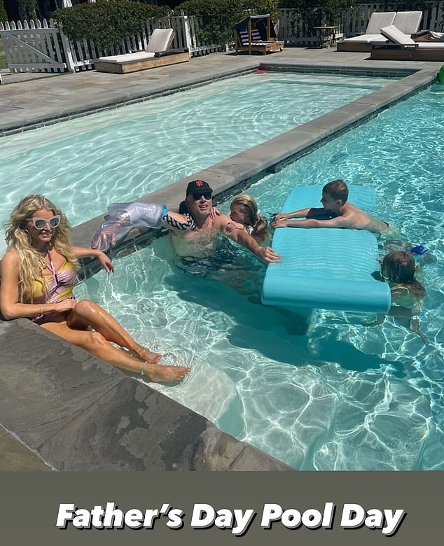 All here: The blonde bombshell held a pool party at her home in Hidden Hills, California where she slipped into a bathing suit as she splashed around with her kids Maxwell Drew, 10, and Birdie Mae, three, as well as son Ace Knute, eight. Her husband Eric Johnson had on a cast