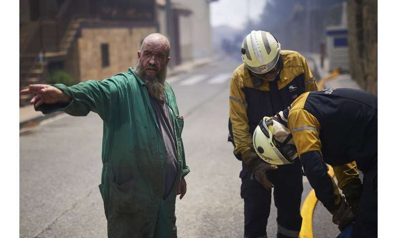 Cooler weather helps Spain with fires; rain helps in Germany