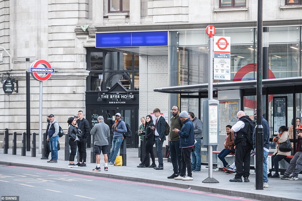 Commuters waiting for busses outside of Victoria Station due to the nation wide rail strike