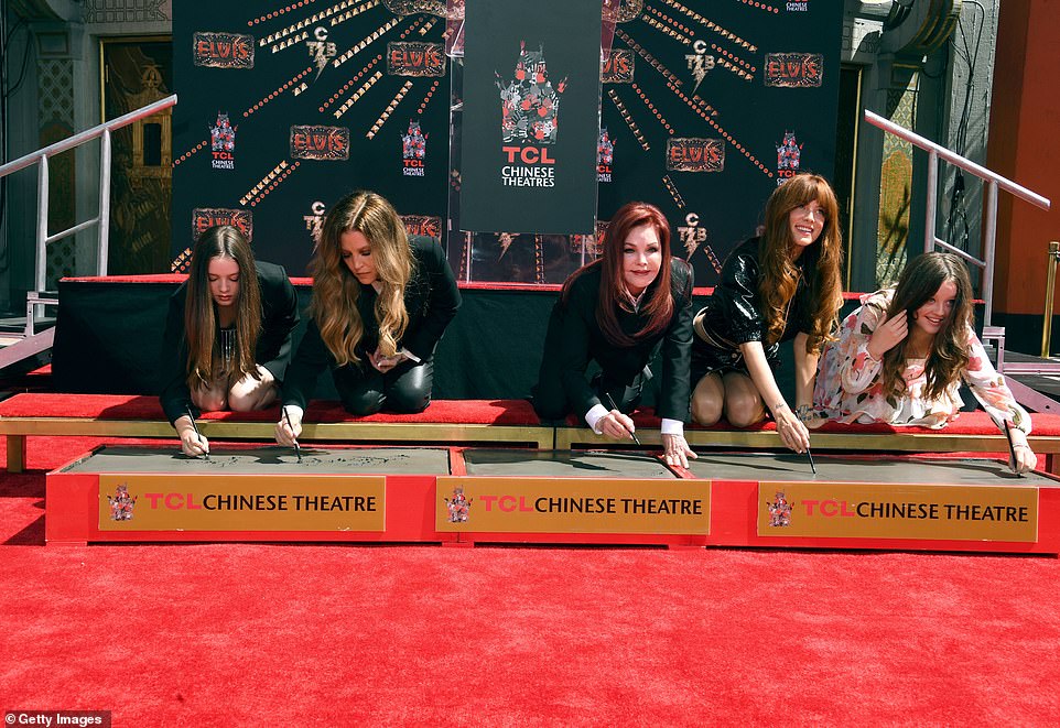 Now signing their names in the cement: All five women (L-R Finley, Lisa Marie, Priscilla, Riley and Harper) signed their names alongside their hand prints