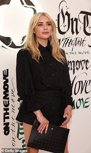 Sensational: Emma styled her platinum blonde locks into loose waves for the event