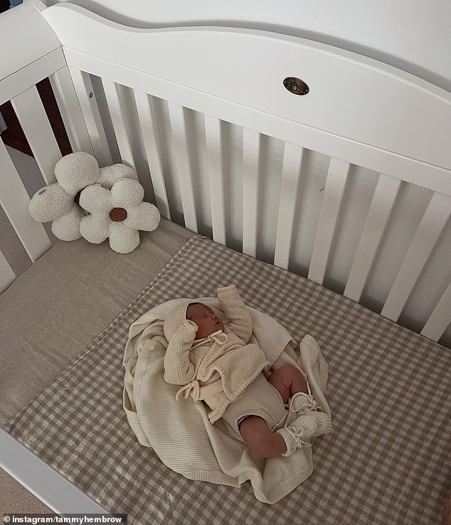 The fitness influencer shared an adorable photo of her daughter sleeping in a cot to Instagram and revealed her name is Posy