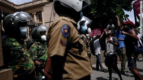 Demonstrators demand the release of protesters who were obstructing an entrance to Sri Lanka&#39;s Presidential Secretariat, amid the country&#39;s economic crisis, in Colombo on June 20.