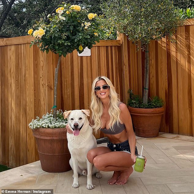 Striking: The 30-year-old reality star showcased her toned midsection in the eye-catching look while posing with her dog Mr. Benedict by the pool at Calamigos Guest Ranch and Beach Club