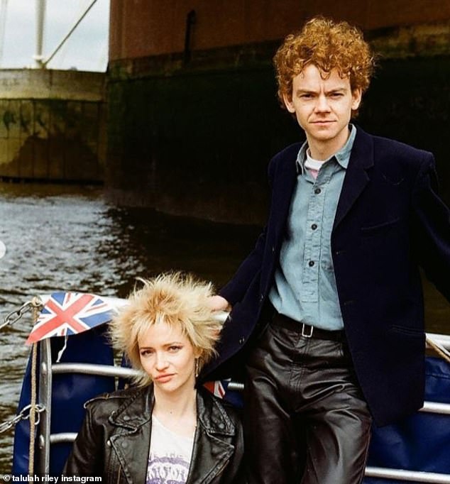 Smart: She styled her short blonde tresses in a chic spikey do while he sported a pair of black leather trousers and blue shirt