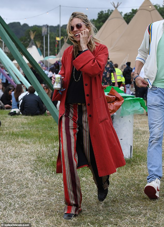 In the detail: She completed her second look with a pair of black shoes and accessorised with a gold chain necklace and a pair of matching earrings