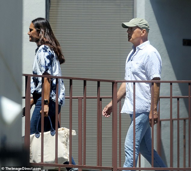 Color-coordinating: The 67-year-old retired actor and the 44-year-old model were both clad in a casual blue and white ensembles for their outing on Thursday