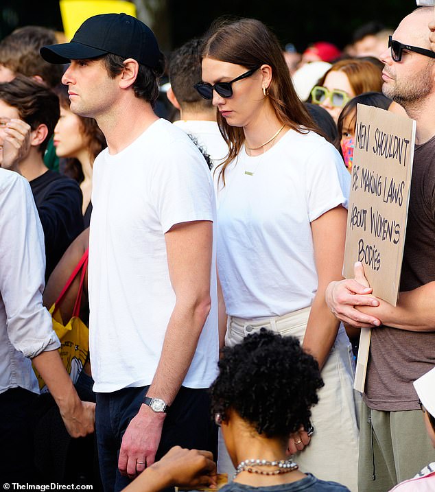 Fashionable and fierce:  She tucked her tee into the pants, cuffing the sleeves ever-so-slightly, and wore three dainty necklaces