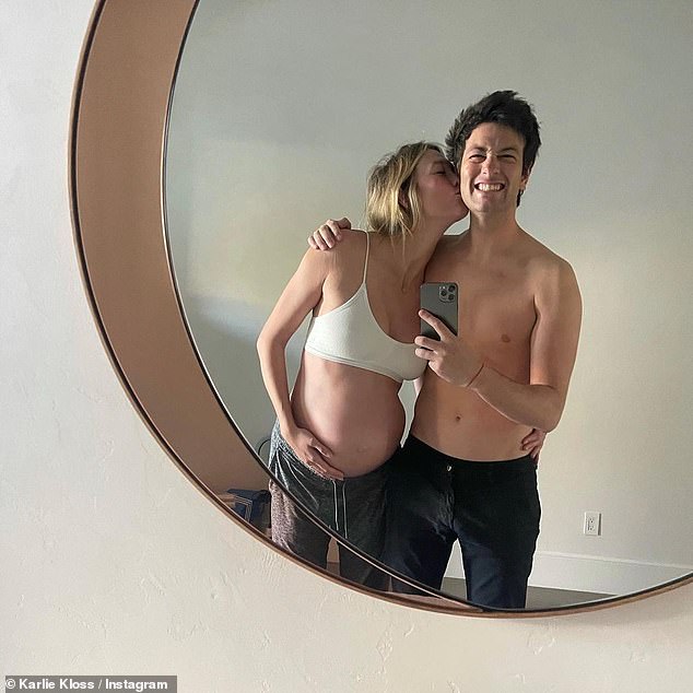 Sweet: Karlie gave Josh a Father's Day shoutout on Sunday, sharing a throwback image from her pregnancy