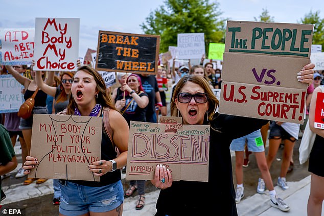 Pro-choice demonstrators participate in a march and rally outside the Republican-led Georgia State Capitol after the US Supreme Court's decision