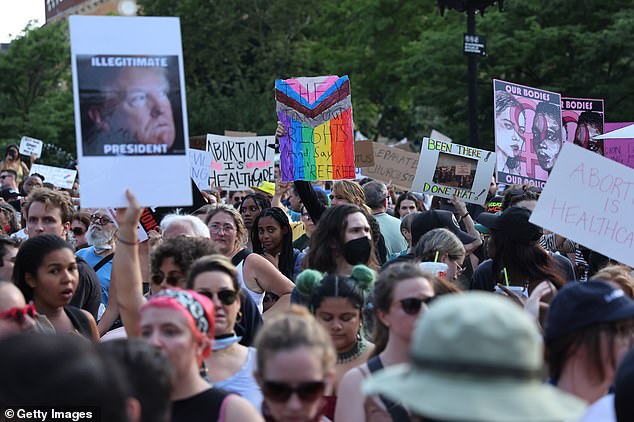 NEW YORK CITY: Protesters on Friday night are pictured in Washington Square Park