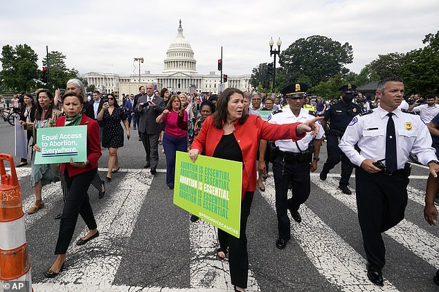 WASHINGTON DC: Democratic members of Congress march out of the Capitol Building toward the Supreme Court to join pro-choice protesters outside the Supreme Court Friday morning