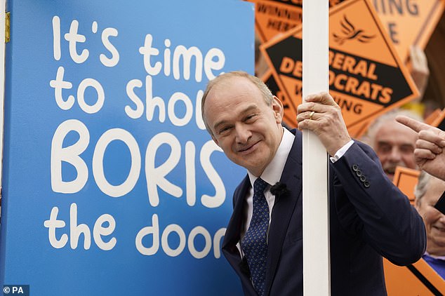 Liberal Democrat Leader Sir Ed Davey celebrates with supporters and activists gathered at the Lowman Green Clock Tower in Tiverton