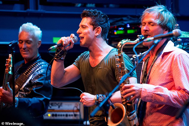 Socking: His performance comes as his ex bandmate, former Spandau Ballet singer Ross William Wild, 34 [centre], appeared in court accused of committing a string of sex attacks [pictured  L-R Spandau Ballet's Martin, Ross and Steve Norman performing in 2018]