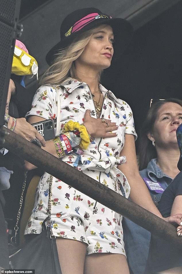 Summer look: For the event, Laura sported a white, denim playsuit with a floral print detail and zip running through the centre