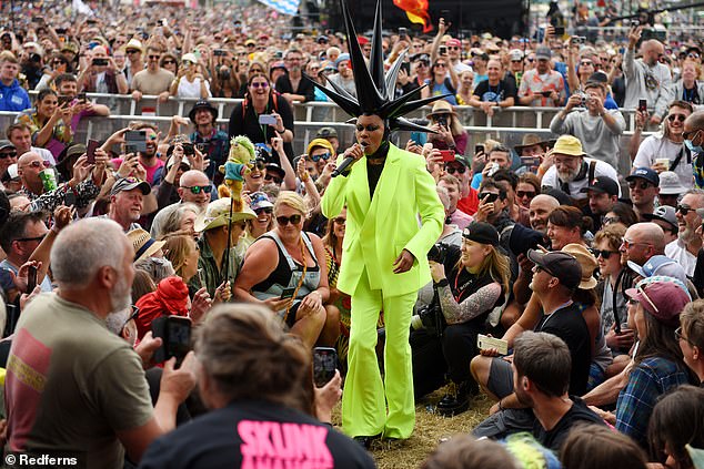 Pride of place: She took her place on a hay bale, as the crowd gathered around to get a glimpse