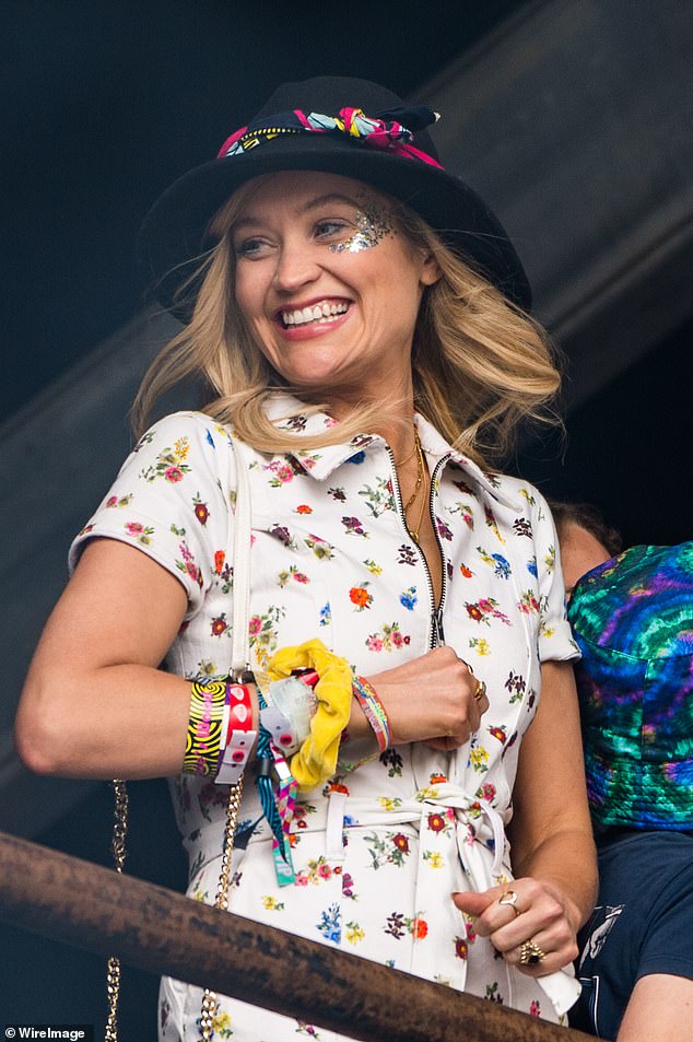 Splash of colour: Laura's hat featured a brightly coloured design around just above the rim while she wore black eyeliner and pink lipstick