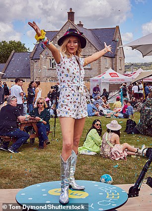 Strike a pose: Laura was seen posing at the at the EE Recharge Tent at the festival in the South West of England