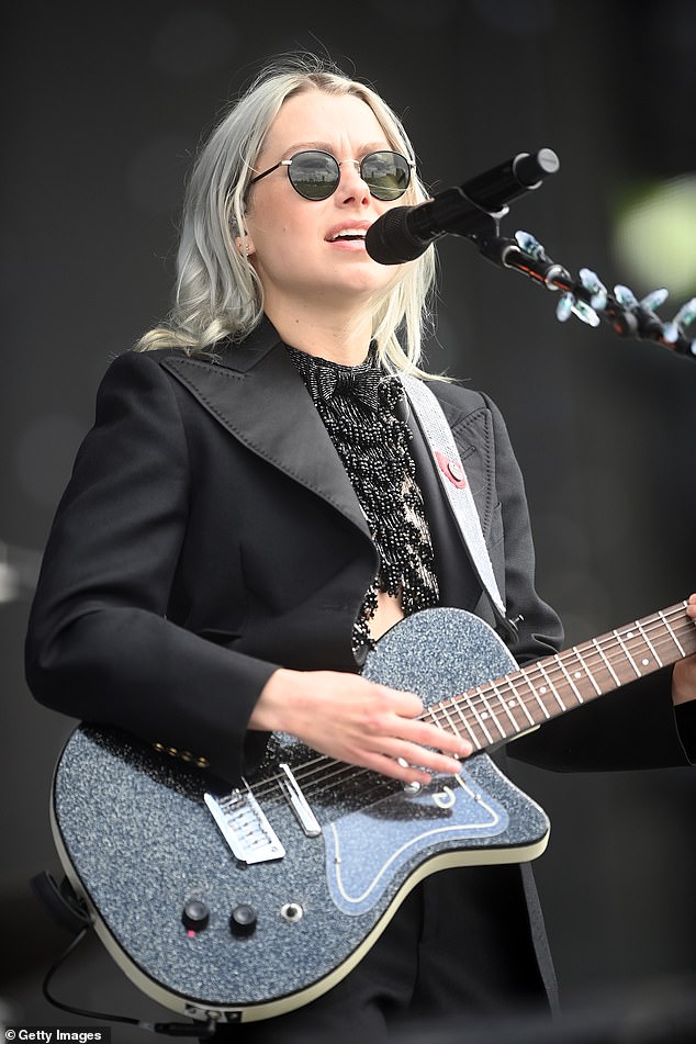 Gracing the stage! The hitmaker sported a matching electric guitar with a glitter effect while she grabbed the mic for her show