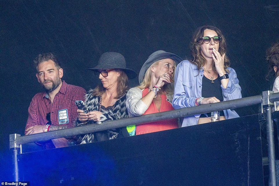 Look who it is! While a vast array of stars descended on Somerset for the festival, among them was Sex Education star Gillian Anderson, who was seen watching Noel's show