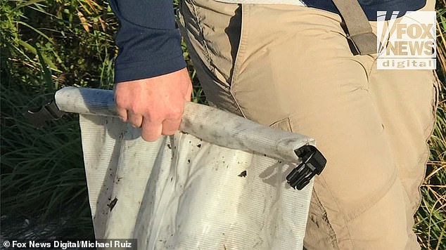 Police and FBI officials retrieved items belonging to Brian Laundrie, including a notebook, near where his body was found in the Myakkahatchee Creek Environmental Park