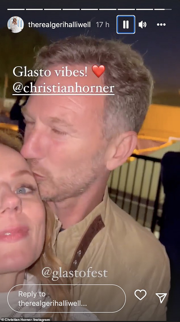 Loved up: Christian planted a kiss on his wife's head as she moved the camera from the stage to their own faces