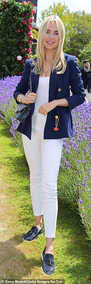 Out of this world: The former Made In Chelsea star, 31, looked chic in a white top and matching jeans