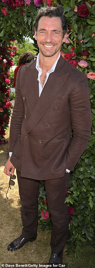 Suave: David Gandy put on a dapper display in a double-breasted brown suitx