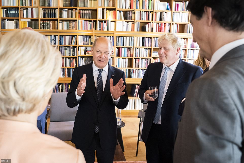 Prime Minister Boris Johnson with (backs to camera) European Union Commission President Ursula von der Leyen and Prime Minister of Canada Justin Trudeau