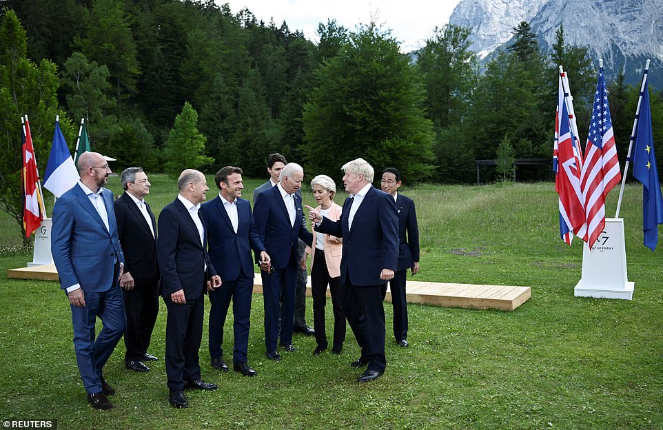 Britain's Prime Minister Boris Johnson speaks with European Council President Charles Michel, Italy's Prime Minister Mario Draghi, Germany's Chancellor Olaf Scholz, France's President Emmanuel Macron, U.S President Joe Biden, European Commission President Ursula von der Leyen and Canada's Prime Minister Justin Trudeau and Japan's Prime Minister Fumio Kishida