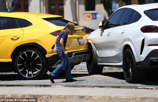 Samuel got out of the car and checked out the spot where the vehicles made contact