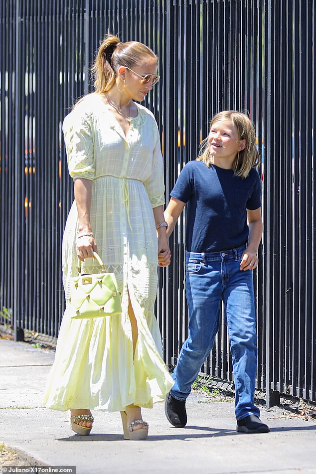 Lopez was seen holding hands with the boy as they were seen walking