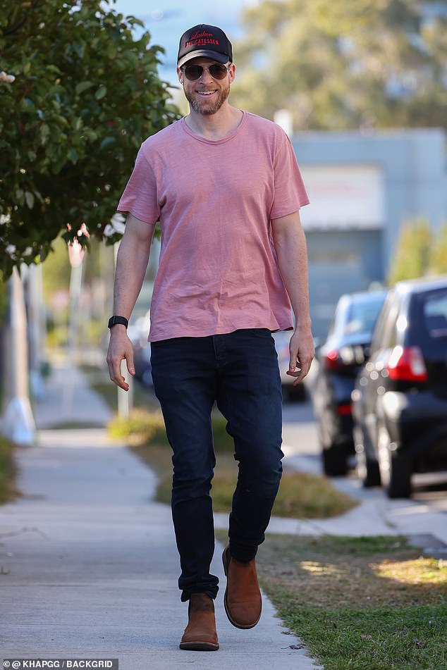 Hamish added a navy cap with a red logo and trendy aviator sunglasses to the look